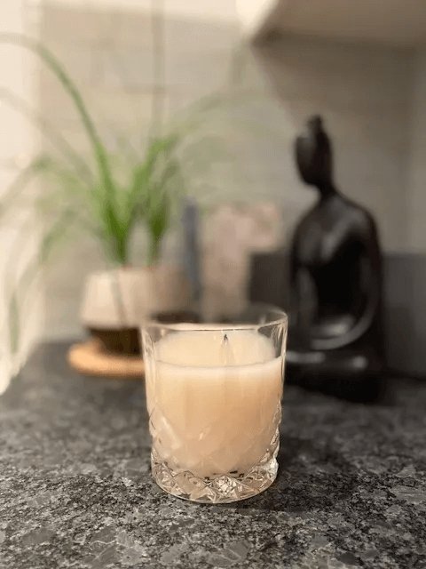 Chhaang served in a glass with a Buddha statue