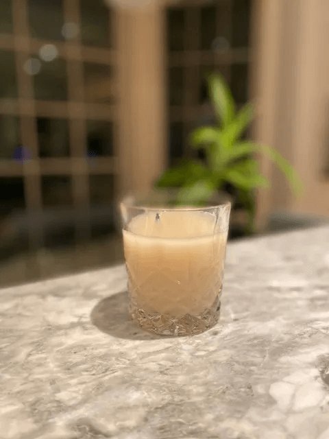 Chhaang served chilled in a glass on a marble counter